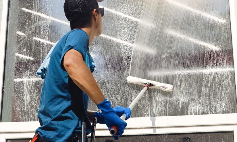 Photo of a man cleaning window
